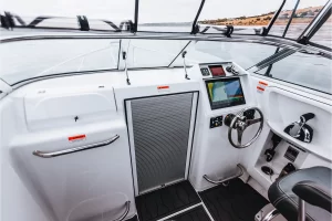 The helm of the Northbank 600C with dash and cabin roller door | Cuddy Cabin | Fishing Boat | Fibreglass Fishing Boat | Northbank Boats